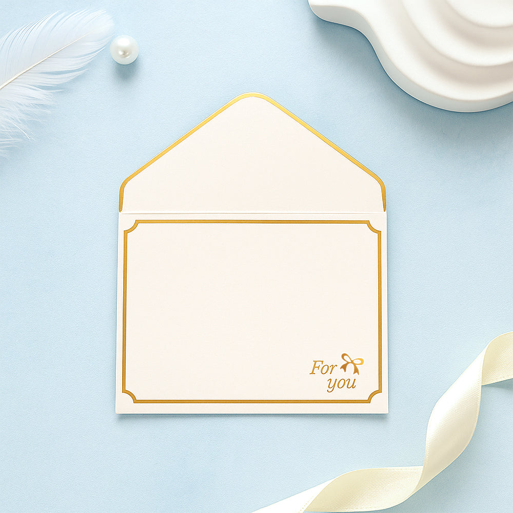 Custom MadeMine greeting card with personalized message and "Best Wishes" envelope on a plain background.