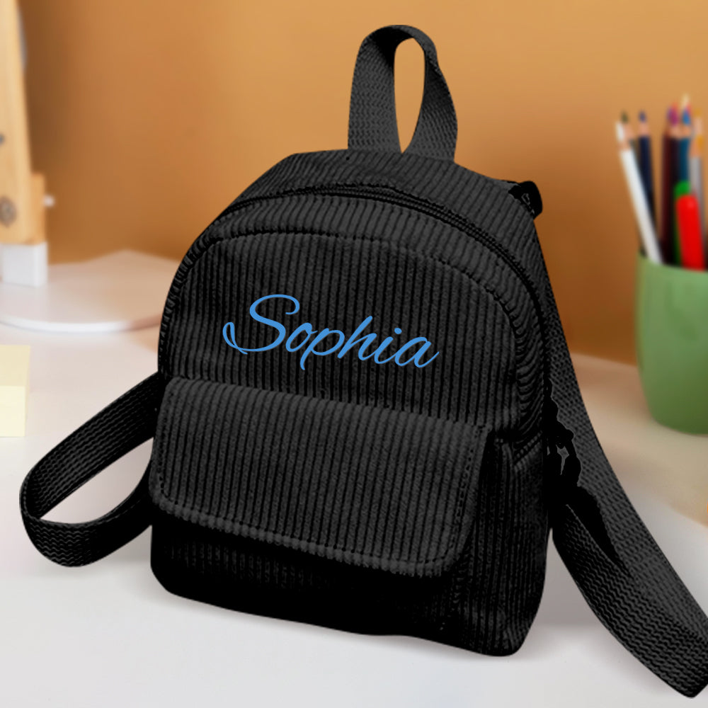 MadeMine personalized mini corduroy backpack with custom name, small school bag for kids, featuring colorful straps and front pocket.