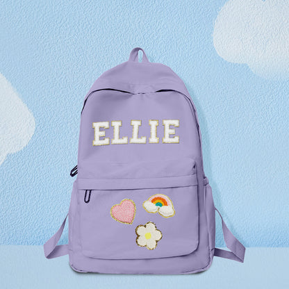 Personalized MadeMine kids' backpack with custom name design, featuring colorful patterns and adjustable straps for school use.