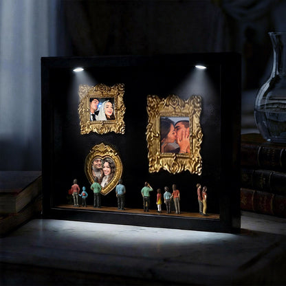 Miniature personalized museum gift in black frame with spotlights, featuring a cute couple scene, by MadeMine.