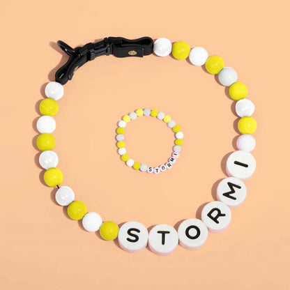 Personalized pet name necklace and matching bracelet by MadeMine, featuring custom pet name charms on jewelry set.