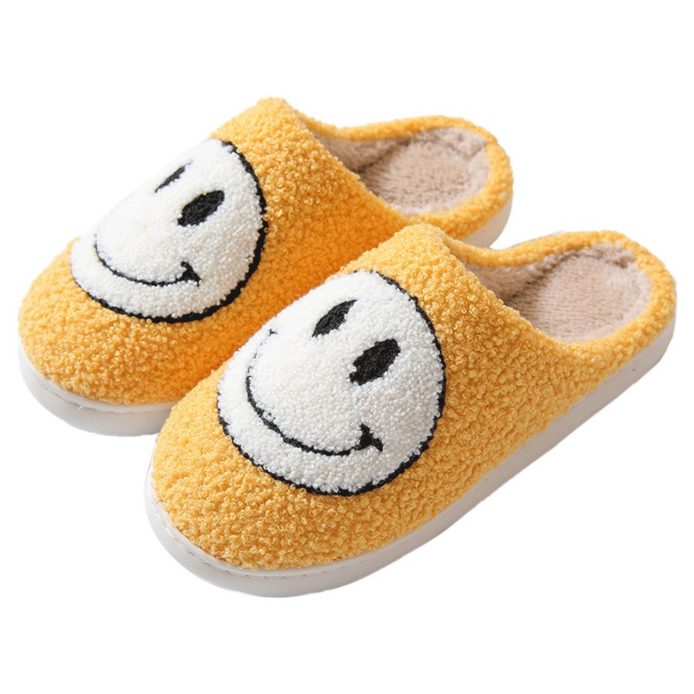 Fuzzy smiley face cotton slippers by MadeMine, warm and cozy house slippers for women and men with fluffy, soft textures.