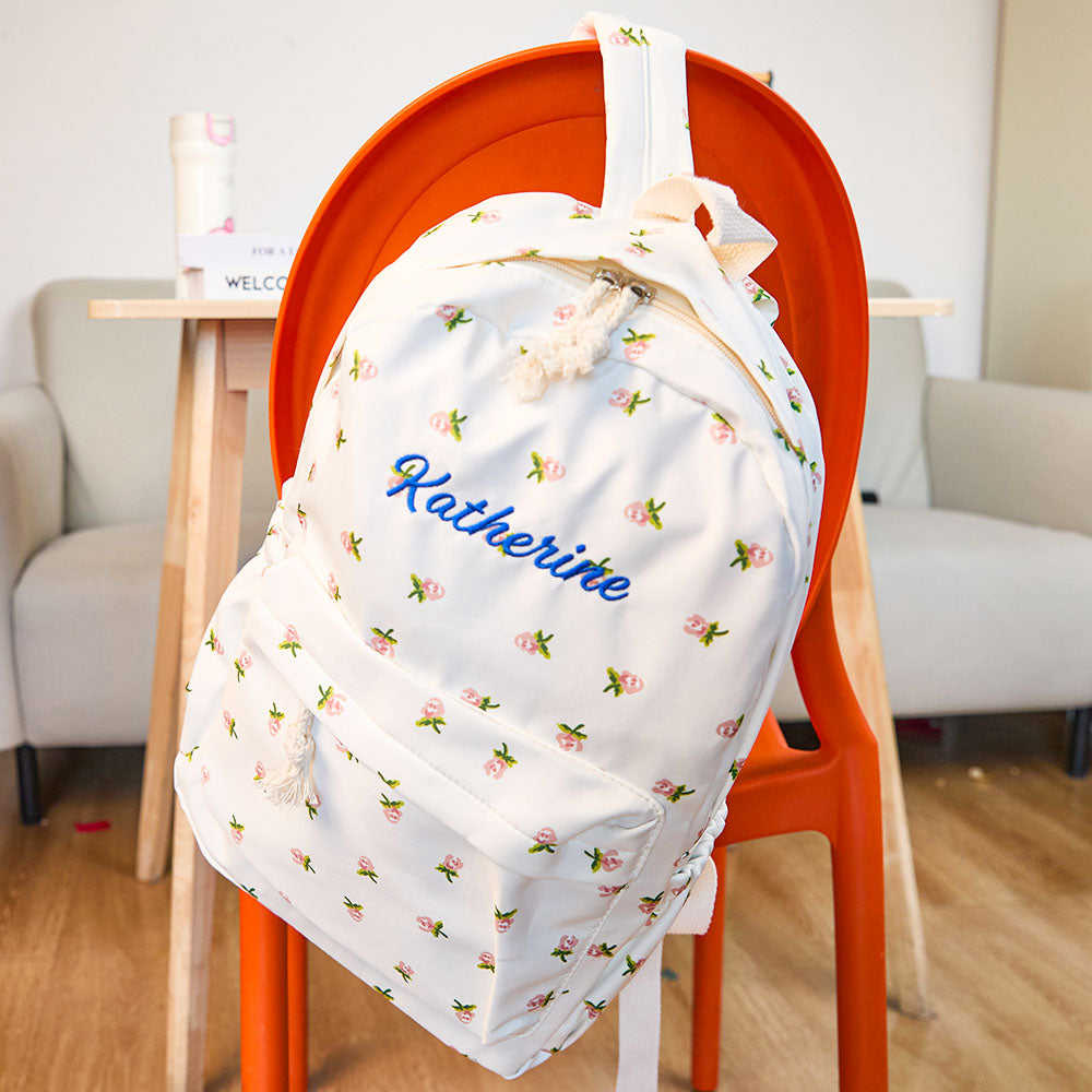 MadeMine personalized nylon girls' backpack with custom name, featuring a spacious school bag design and colorful accents.