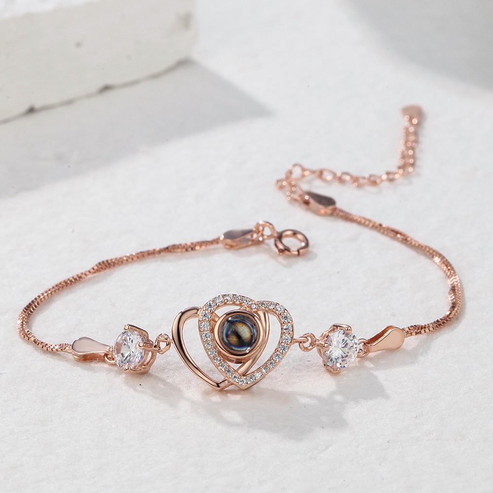 Custom double heart projection bracelet made of 925 sterling silver by MadeMine, featuring intricate heart designs and polished finish.