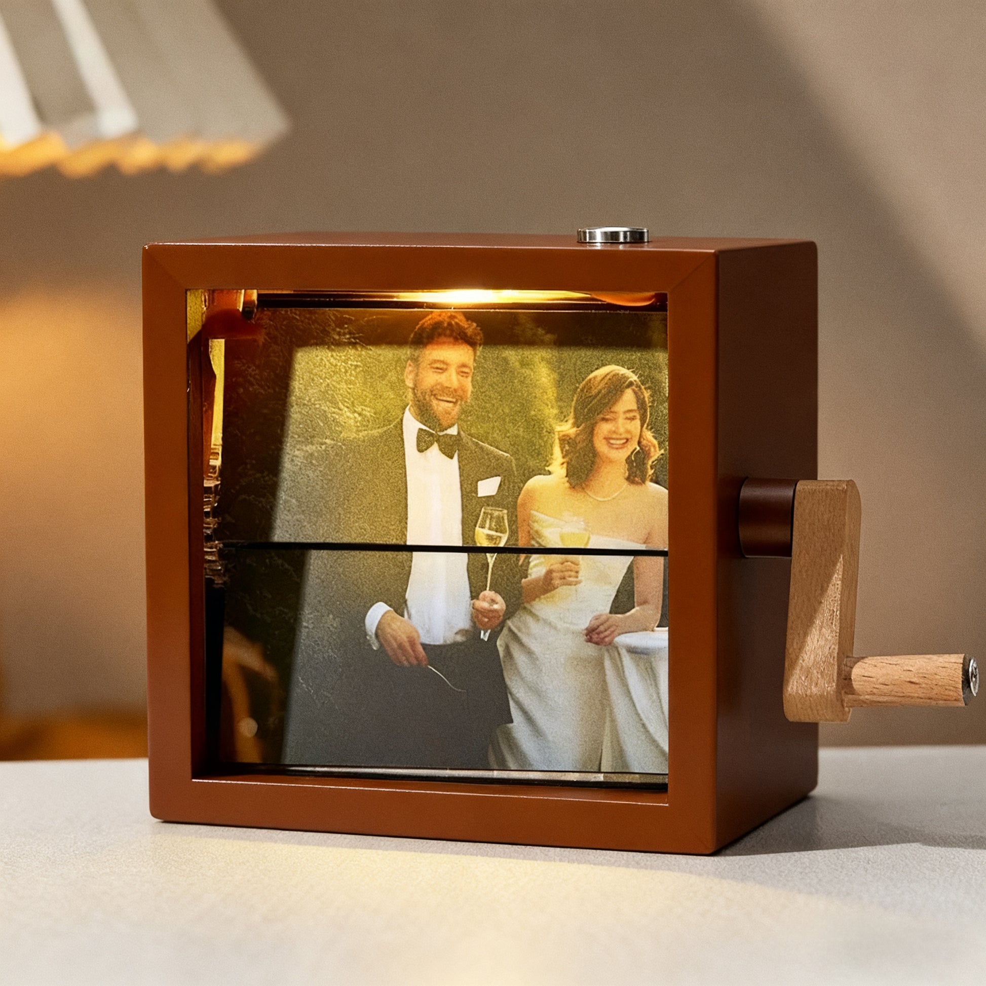 MadeMine personalized photo flipbook frame with hand-crank animation, featuring a lighted display for custom photo animations.