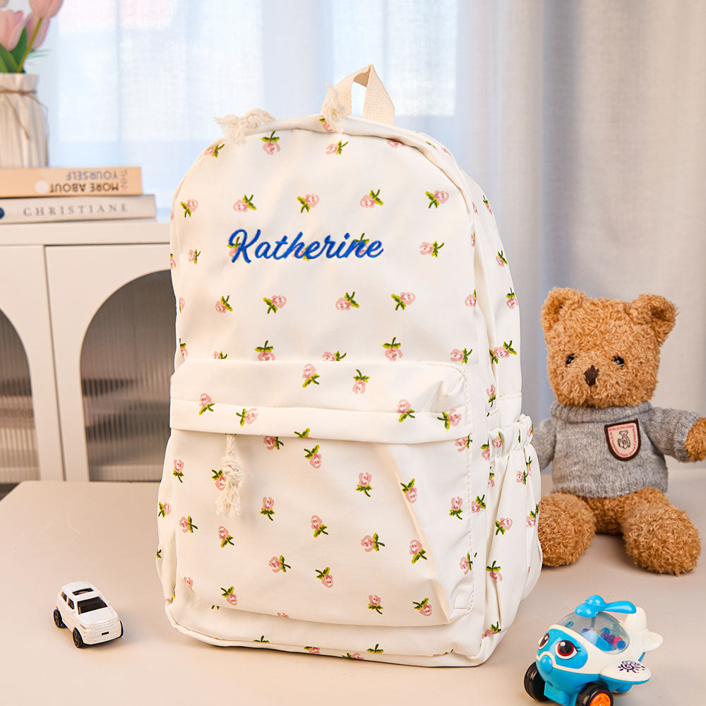 MadeMine personalized girls' nylon backpack with custom name, featuring colorful design and adjustable straps for school or gift.